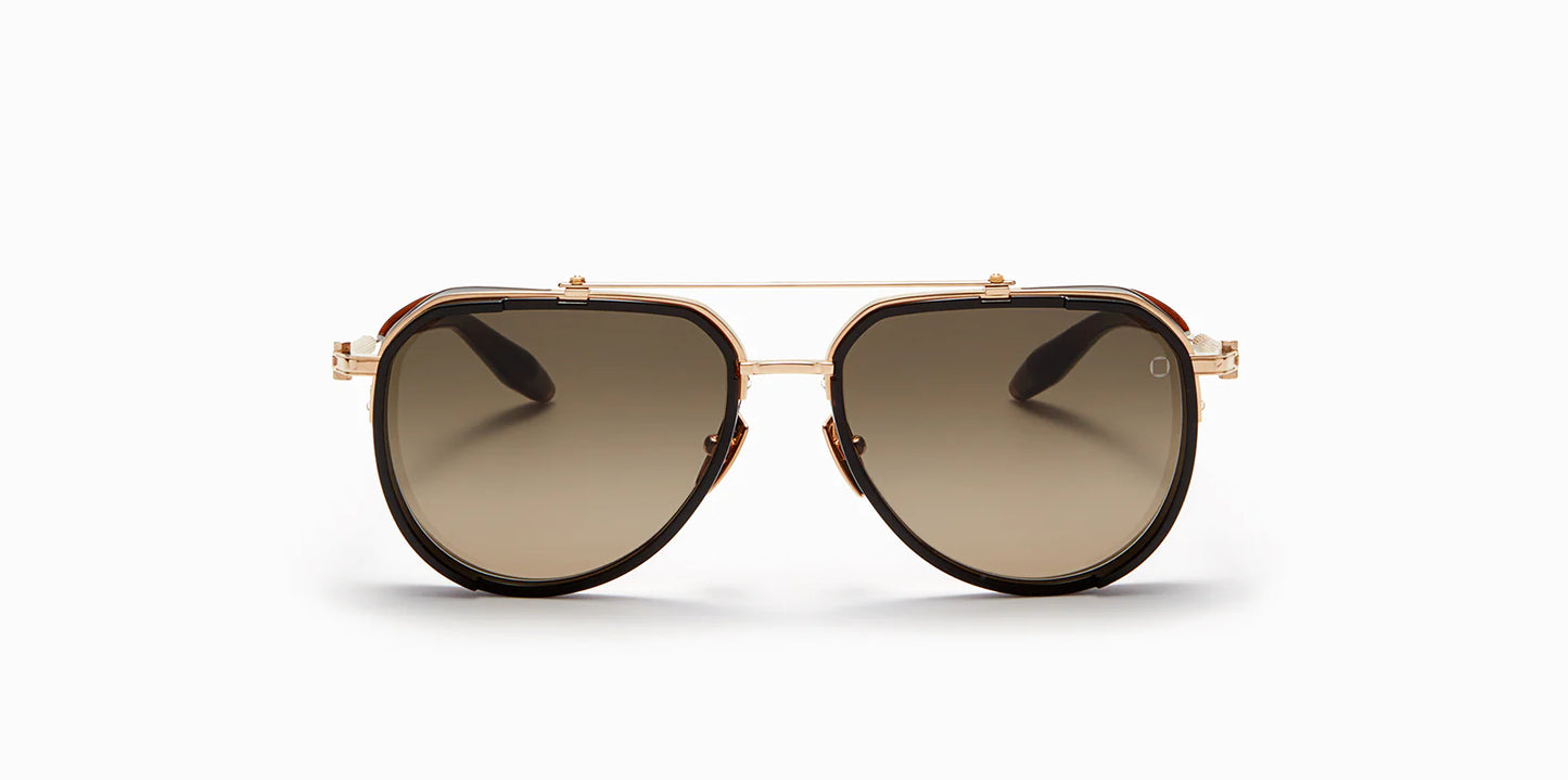 Front view of Akoni's "Echo" frame, a classic aviator shape with a unique frontal hood and black enamel accents around the edge of the trim.