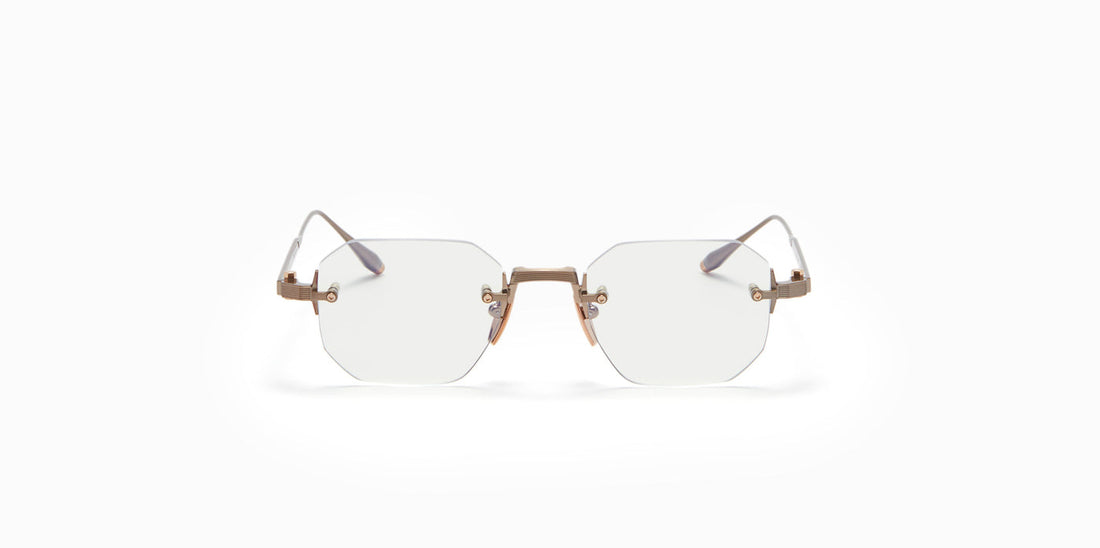 Front view of Juno One eyeglasses by Akoni in the antiqued white gold colorway.