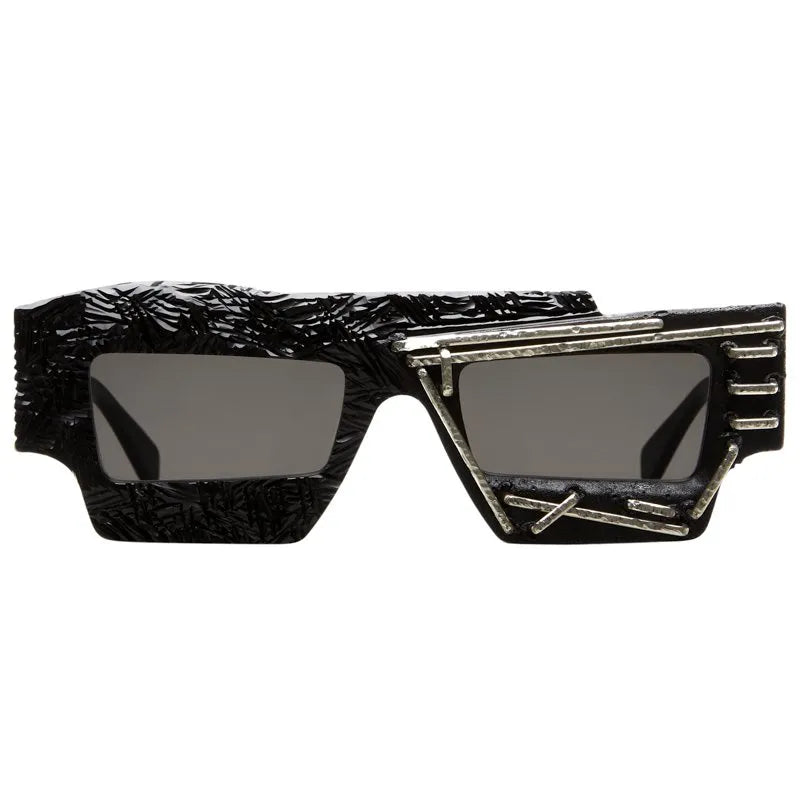 Kuboraum Mask X12 rectangular sunglasses in textured black acetate with metal detailing, the Mask documented on Madonna