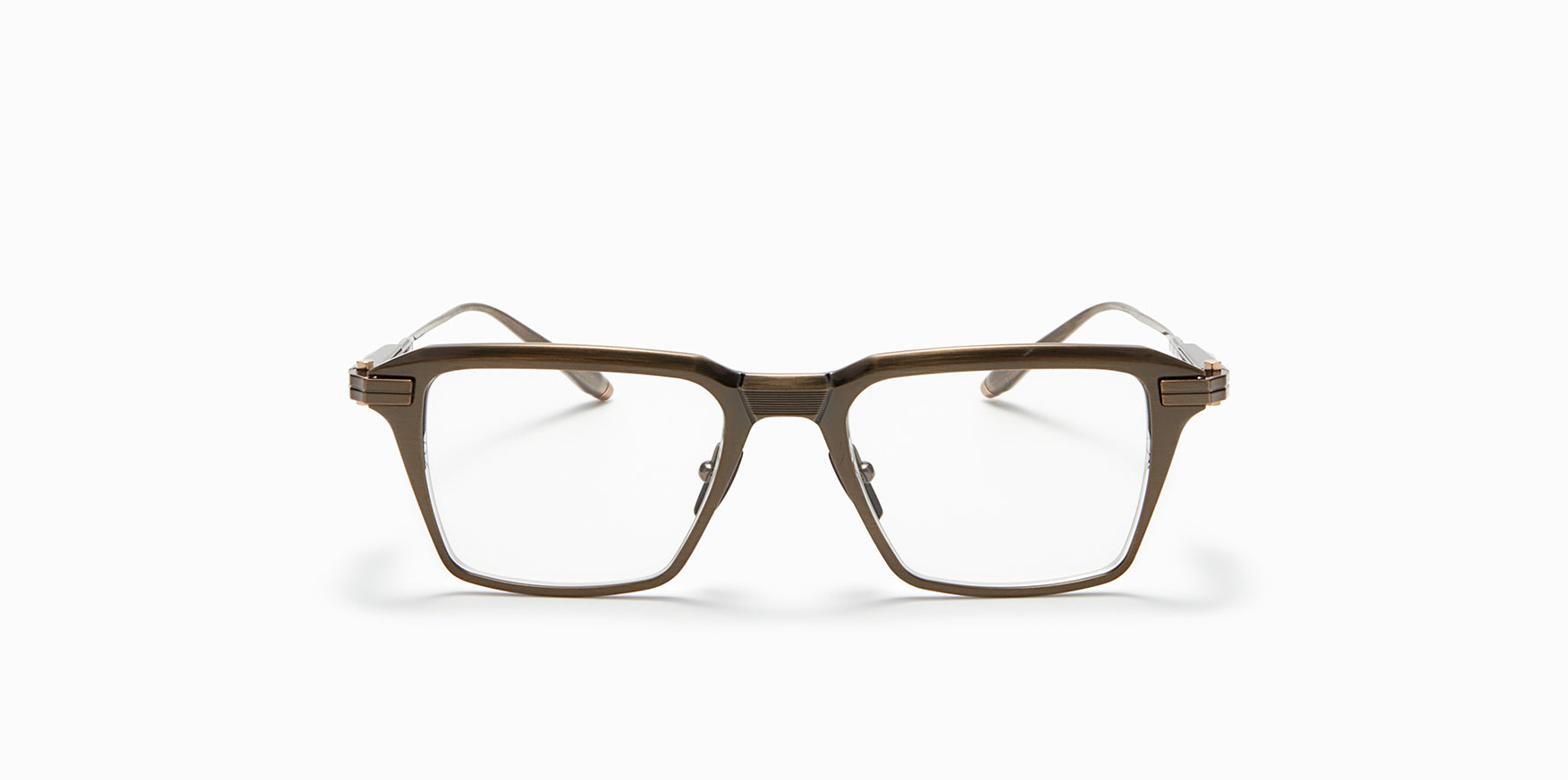 Front view of Akoni's Swift frame in the antiqued white gold colorway.