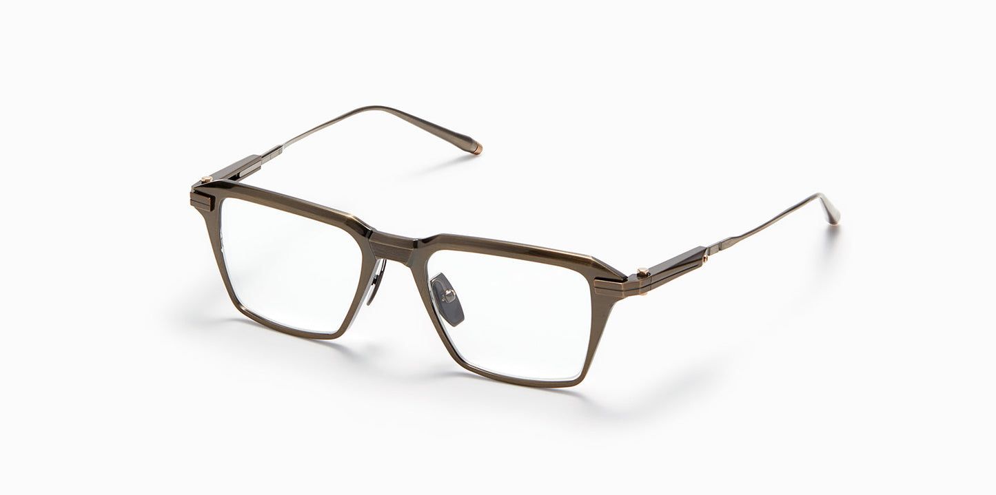 Three-quarter profile view of Akoni's Swift frame in the antiqued white gold colorway.