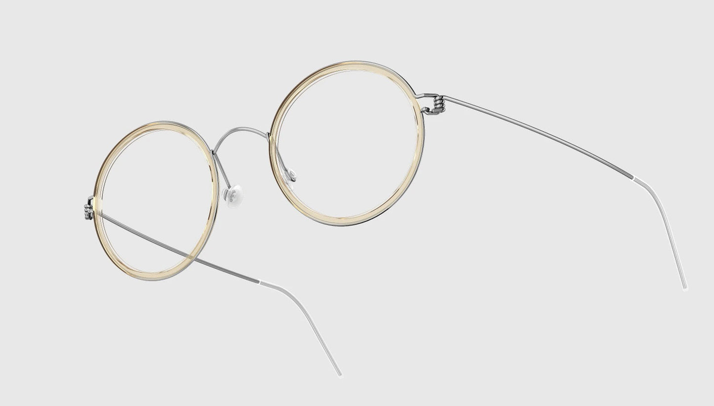 LINDBERG Air Titanium Rim Cameron — Silver frame with Polished Clear/Honey acetate inner rim — titanium eyeglasses — three-quarter view — official product render