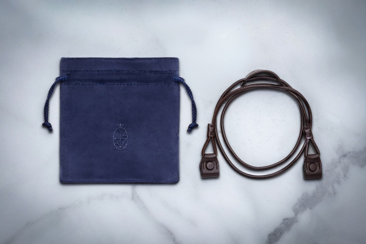 The 1992 is accompanied by custom leather eyewear straps. - Alternate View