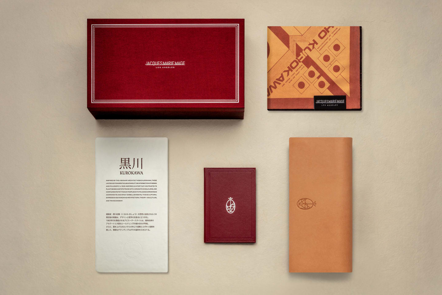 Jacques Marie Mage custom monograph box in the brand's signature burgundy Bordeaux Empire color, which includes the following accessories: one leather eyewear case,  one double-sided microfiber cleaning cloth depicting custom Kurokawa inspired artwork, literature about the collection, and a hand numbered certificate of authenticity on archival-quality washi.