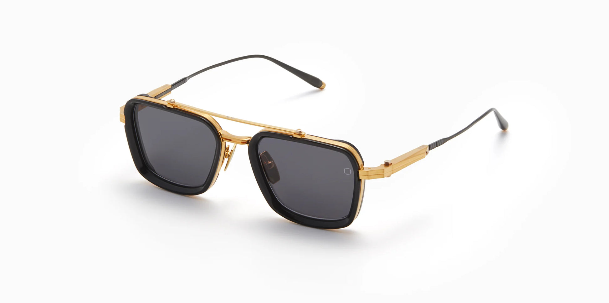 Three-quarter view of Akoni's new "Solis" frame in the black and gold colorway, a squared-off navigator silhouette with adjustable temples and a sculpted Japanese Acetate front set within a striking Japanese Titanium frame.