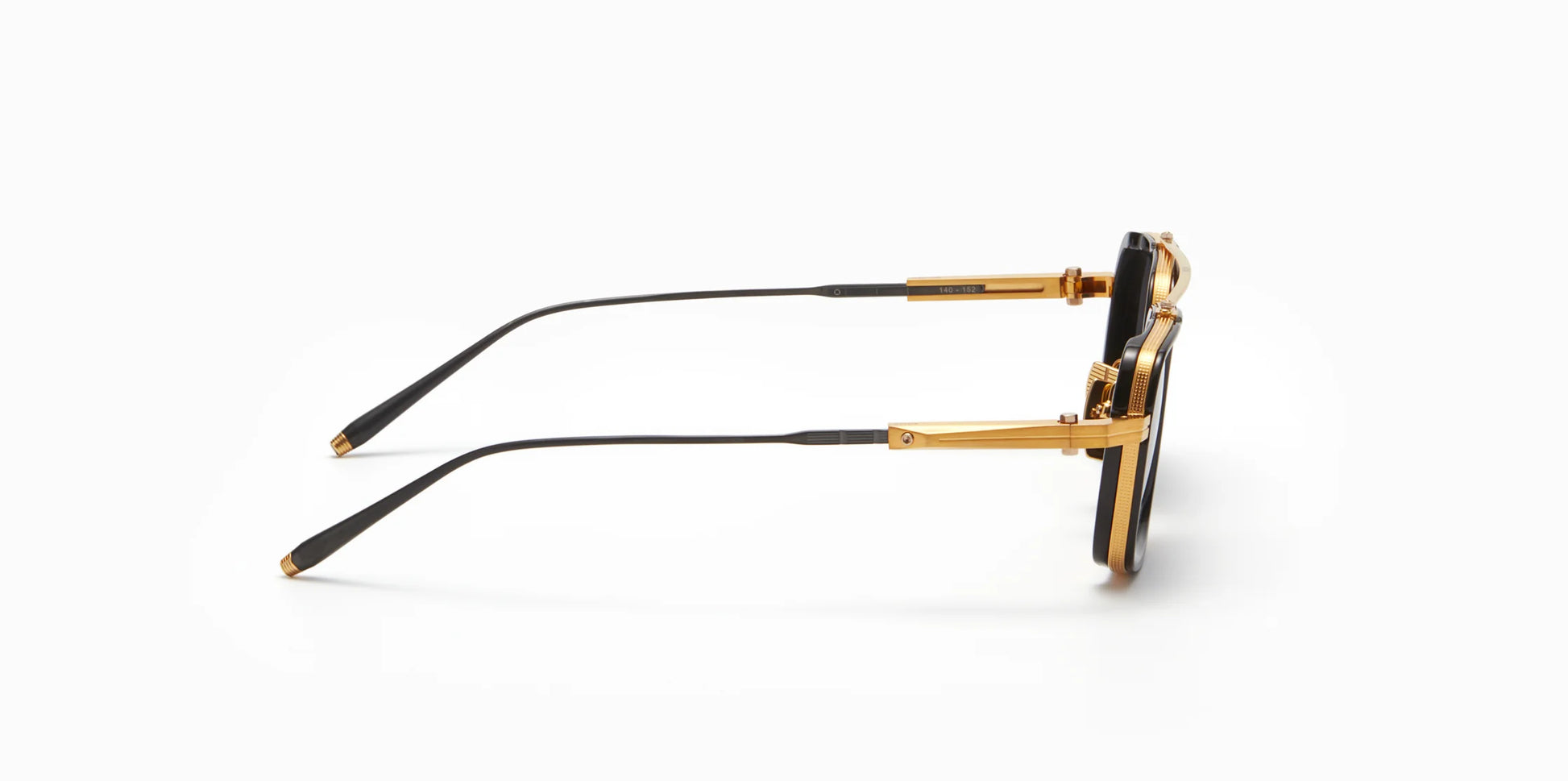 Side view of Akoni's new "Solis" frame in the black and gold colorway, a squared-off navigator silhouette with adjustable temples and a sculpted Japanese Acetate front set within a striking Japanese Titanium frame.
