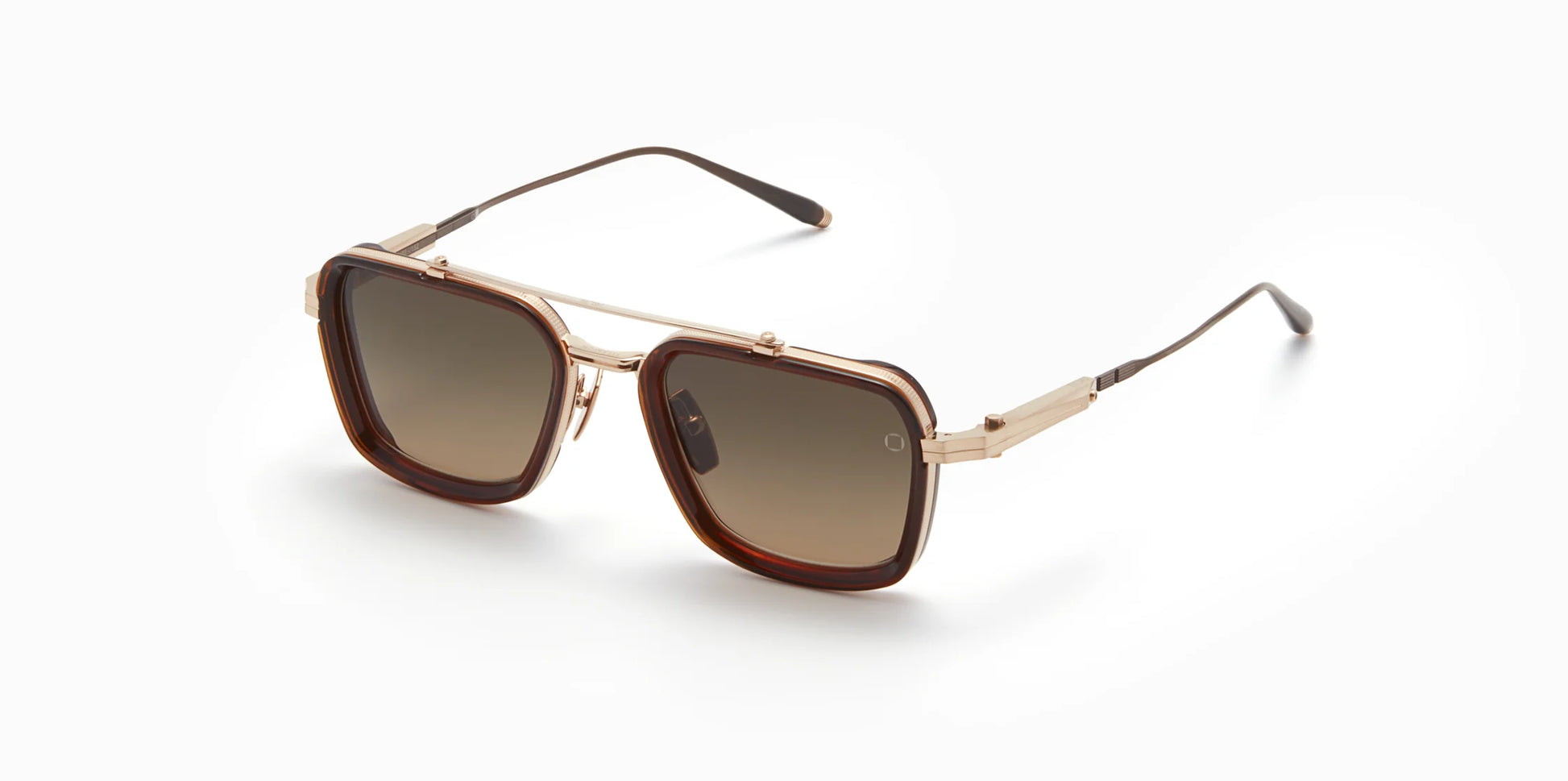 Three-quarter view of Akoni's new "Solis" frame in the white gold/dark brown crystal colorway, a squared-off navigator silhouette with adjustable temples and a sculpted Japanese Acetate front set within a striking Japanese Titanium frame.