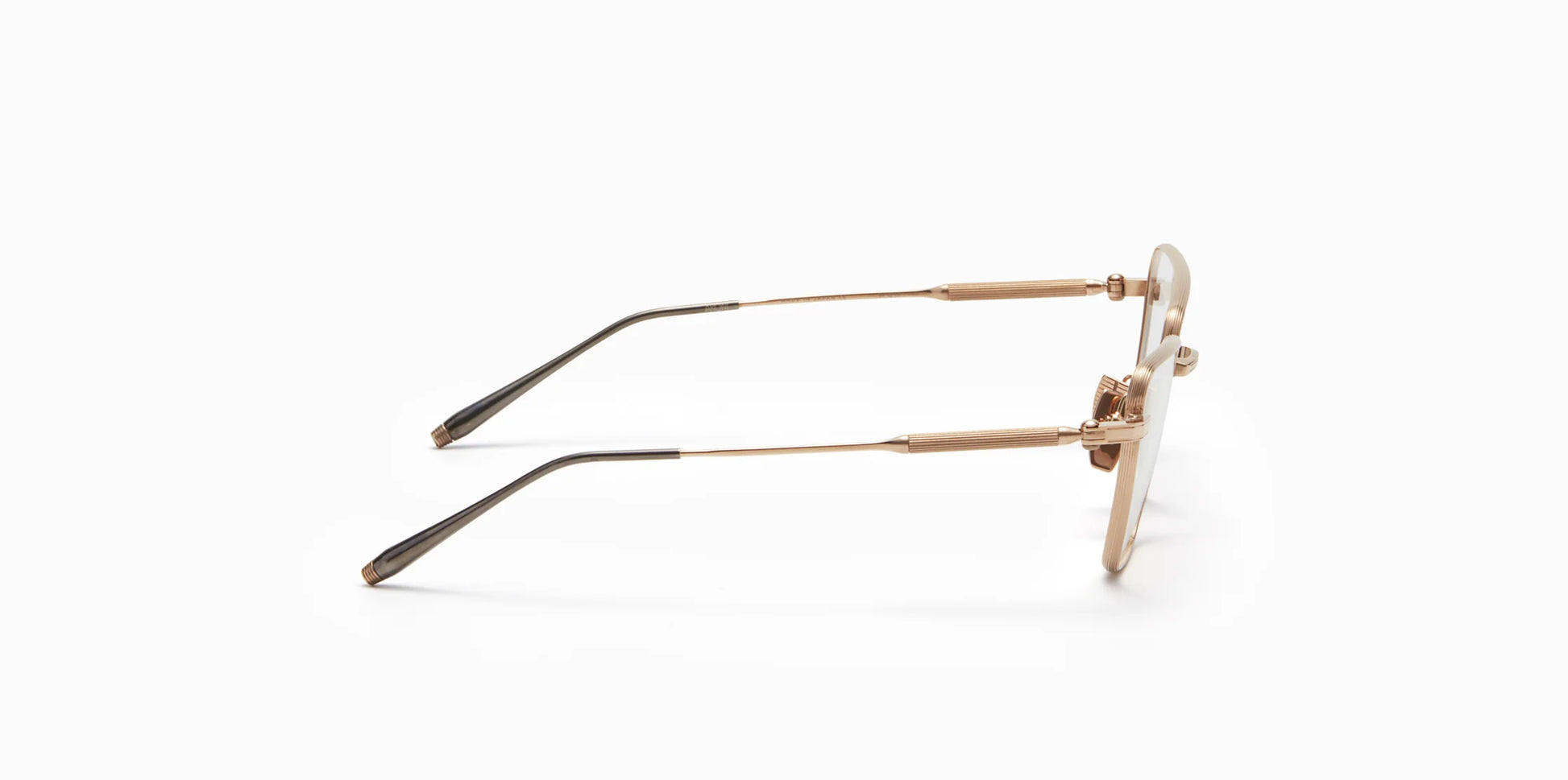 Side view of Akoni's new "Vega" frame in the brushed white gold colorway.