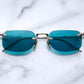 Jacques Marie Mage rimless sunglass "Fonda" in the Altan color with aqua colored lenses