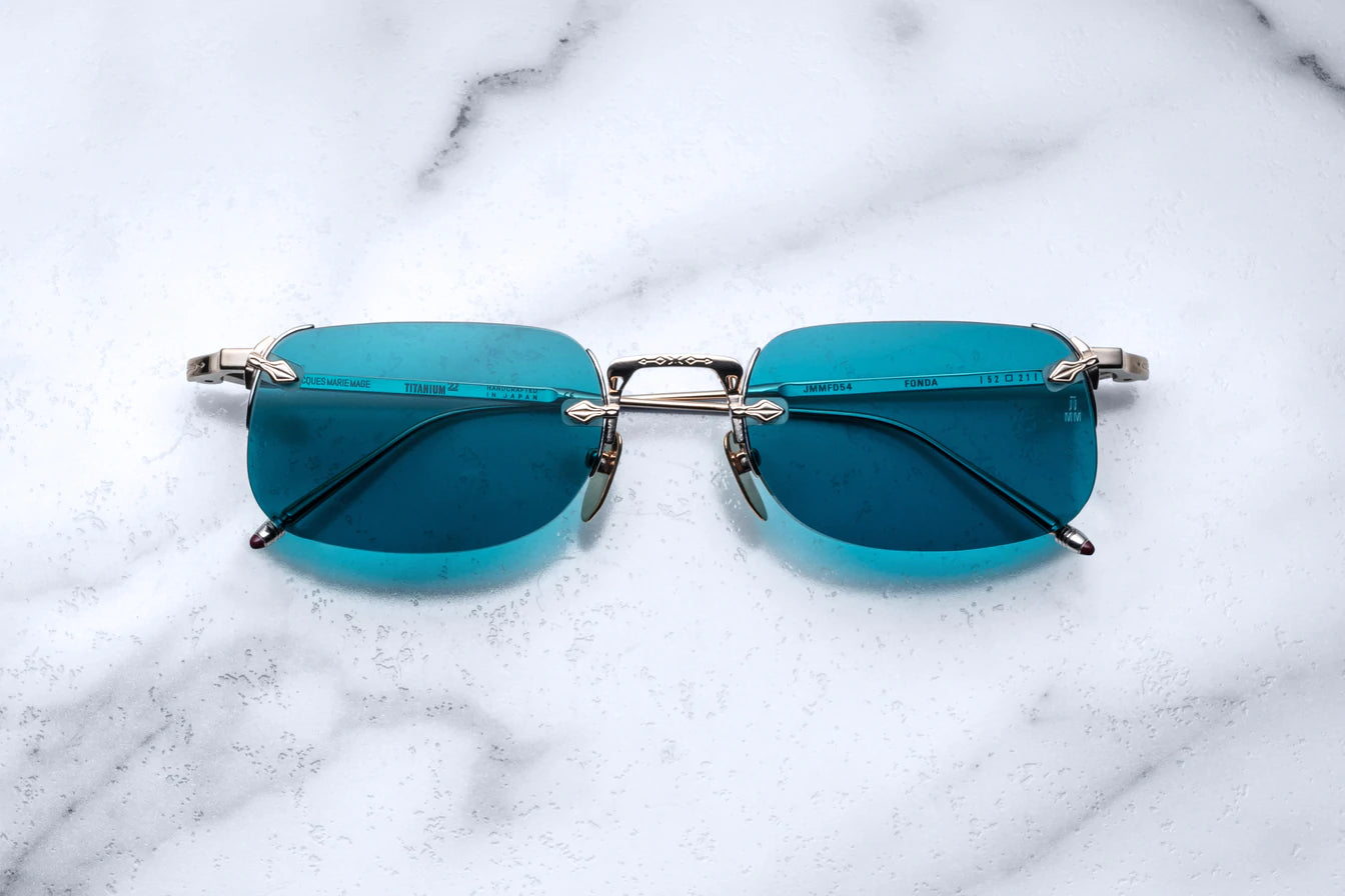 Jacques Marie Mage rimless sunglass "Fonda" in the Altan color with aqua colored lenses